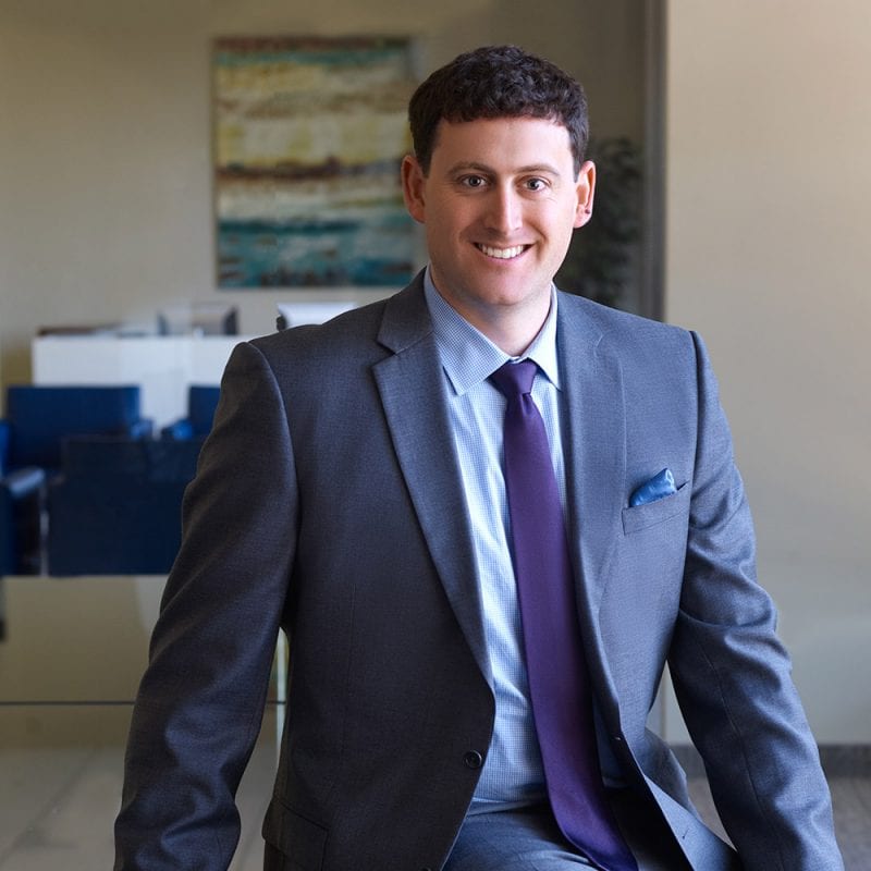 Paul Skrickus wearing suit