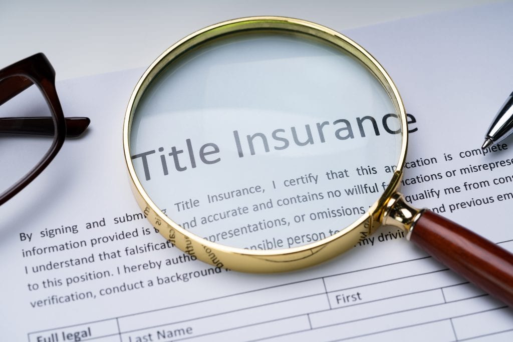 Title insurance document with magnifying glass